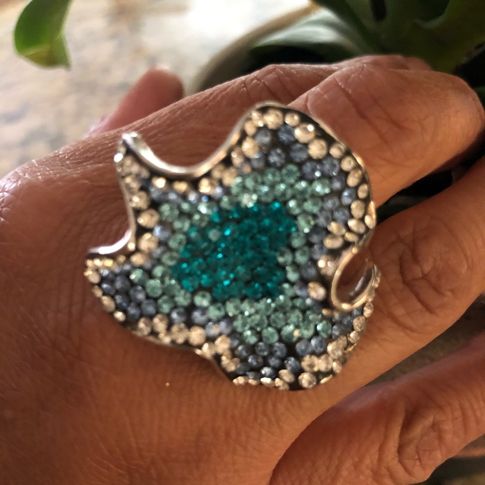 Woman’s ring with blue stones. Not sure what you call this shape🤷‍♀️